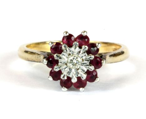 A 9ct yellow gold diamond and ruby set cluster ring, (N).