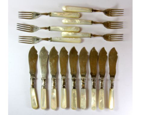 A set of fish knives and forks with mother of pearl handles and sterling silver ferrules.