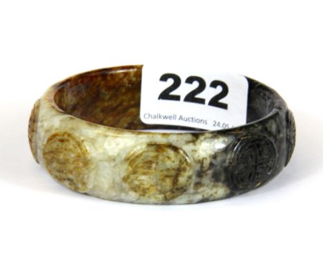 An old Chinese carved mixed colour jade engraved bangle, internal Dia. 6.5cm.