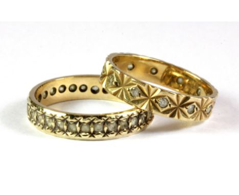 Two 9ct yellow gold stone set full eternity rings (K).