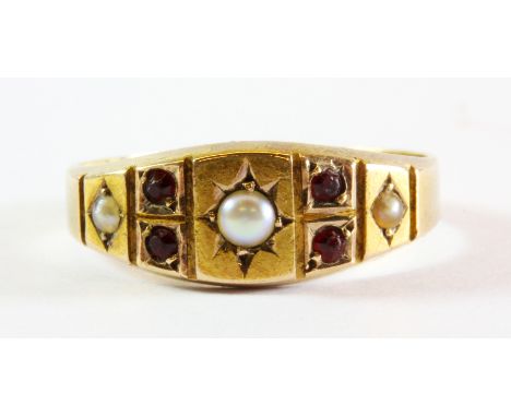 A gentleman's 15ct gold ruby and pearl set ring, (N.5).