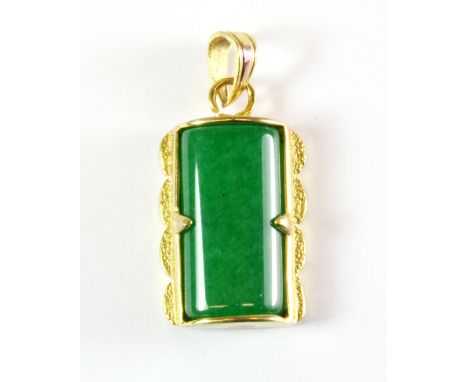 A gilt mounted jade pendant, L. 3cm.