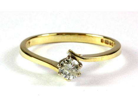 An 18ct yellow gold diamond set solitaire ring, (K).