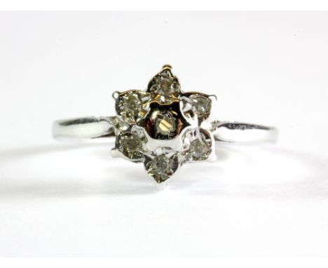 A 9ct white gold diamond set cluster ring, (K.5).