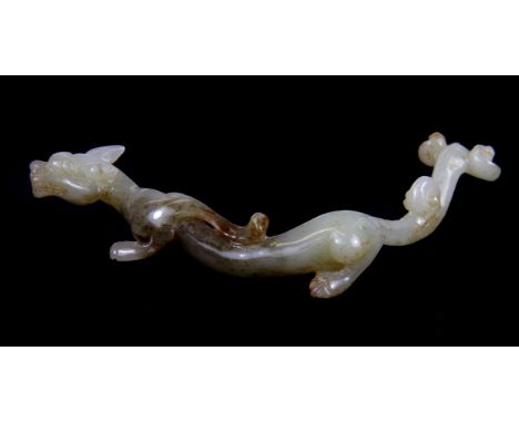 A fine Chinese carved jade figure of an elongated dragon (probably 19th Century), L. 12.5cm.