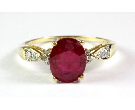 A 9ct yellow gold ruby and diamond set ring, (N.5).