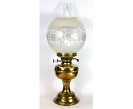 A brass oil lamp.