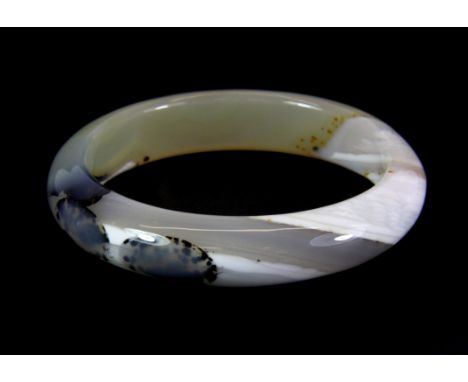 A polished banded agate bangle, Dia. 6.3cm.
