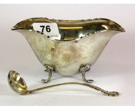 A sterling silver bowl and ladle, W. 14cm H. 7cm.