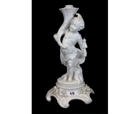 A 19th Century white porcelain oil lamp base of a cherub, H. 34cm.