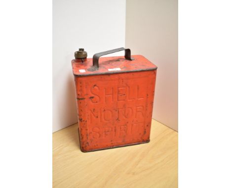 A vintage red-painted Shell Motor Spirit fuel can