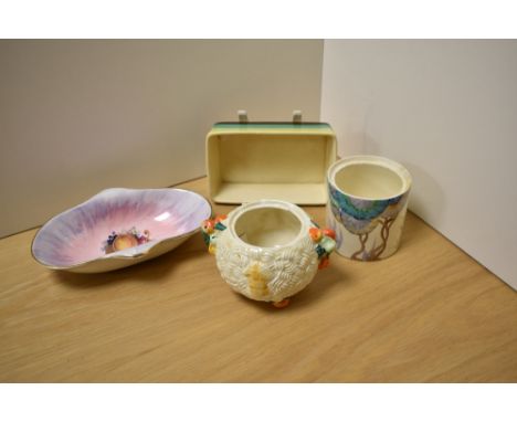 A Clarice Cliff Newport Pottery Bizarre striped rectangular dish, sold together with three other Clarice Cliff items includin