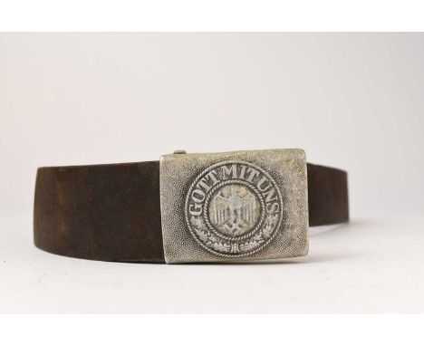 A Second World War German Third Reich Army NCO/EM belt with buckle, the brown leather belt with a tab indistinctly marked, 'F