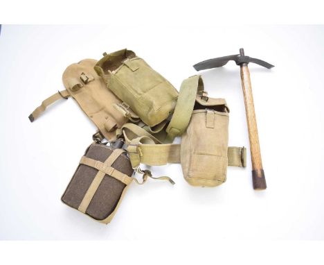 An assembled Second World War British Army webbing set comprising a belt with 1937 Pattern entrenching tool, dated 1945, in c