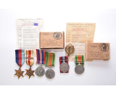 SECOND WORLD WAR: Two medal groupsA pair of Defence Medal and 1939-34 War Medal with ATS cap badge, in a box of issue. named 