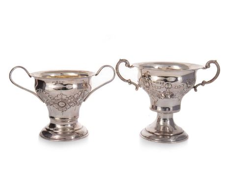 TWO GEORGE V SILVER GILT URNS M. R., LONDON 1926 &1929 each with twin-handlesthe larger 13cm highQty: 345g