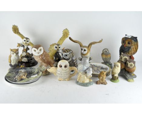 A collection of wooden and ceramic owl sculptures, together with a novelty teapot and two sets of plates, all featuring owls