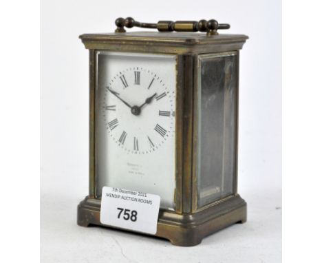 A French brass cased carriage clock, the white dial with Roman numerals, height 11.5cm