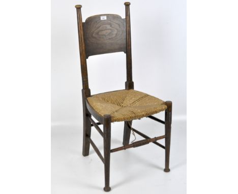 An Arts & Crafts chair in the Glasgow School manner by William Birch, High Wycombe,with shaped panels backs, ring turned fram