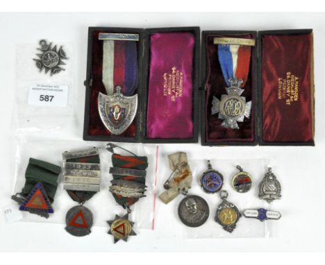 A collection of silver and white metal medallions, to include two boxed RAOB masonic jewels, cased, driving competition award