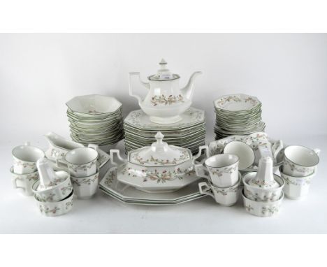 An extensive Johnson Bros tea and dinner service, of geometric form, with printed decoration of flowers and ribbons