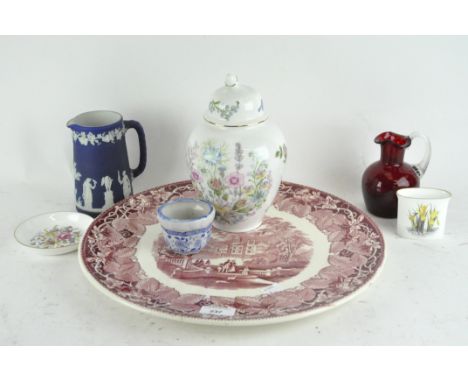 A Masons charger, printed with a scene of figures beside a lake with a floral border, together with a Wedgwood Jasperware jug