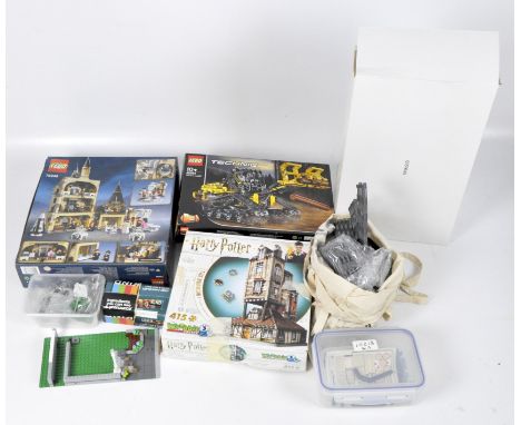 A collection of Lego sets, including Harry Potter 'Hogwarts Clock Tower' 75948 and Lego Technic 'Tracked Loader' 42094, both 