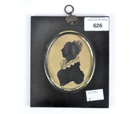 A late 19th/early 20th Century portrait miniture, featuring the profile of a woman, of oval form, mounted in a black frame wi