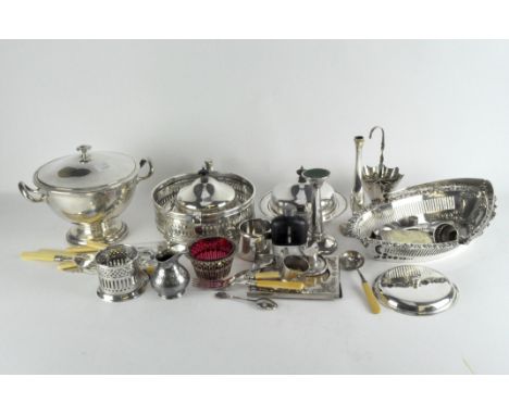 A collection of silver plate, including a photo frame, cigarette case, lidded dishes, flatware and napkin rings