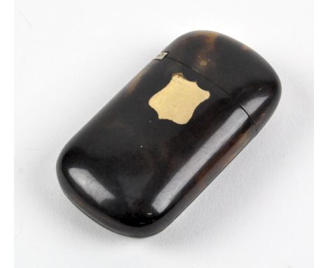 A late 19th/early 20th century tortoiseshell snuff box of flattened ovoid shape. with hinged lid and gold plated shield inlay