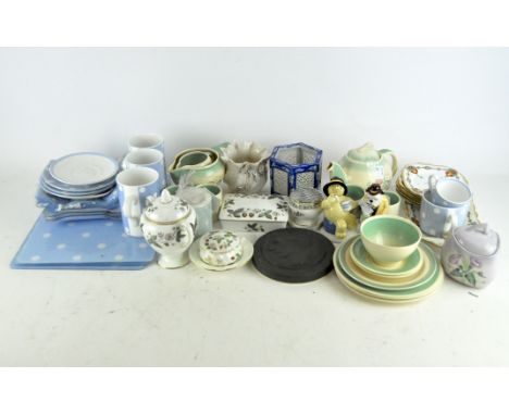 A Susie Cooper part tea service, comprising a teapot, cups, saucers, jug and serving plates, all with floral decoration, toge