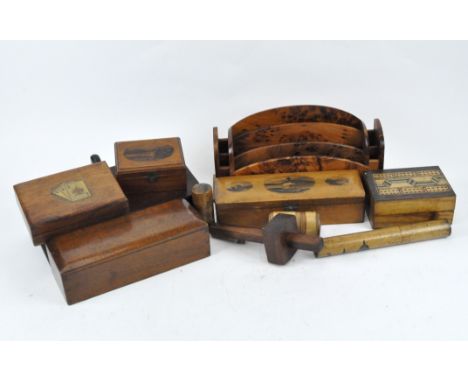 A selection of wooden wares, to include Mauchlin ware lidded boxes and pots, including one adorned with the Scott Monument, a