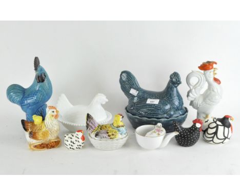 A group of assorted ceramic chickens in the form of figurines, boxes and a candlestick, maximum height 25cm