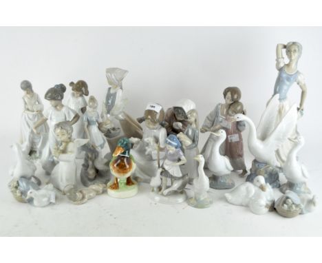 A collection of Lladro and Nao figures, including geese, women and children