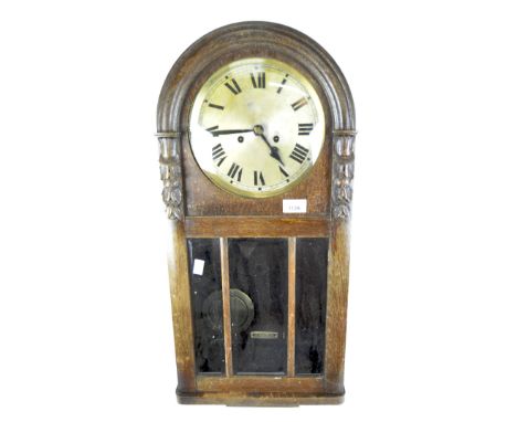 A Victorian wall clock, the gilt dial with Roman numerals, the domed mahogany case with carved decoration and a glass panel t