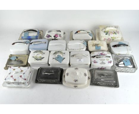 A large collection of sardine dishes, ceramic, glass and beaten copper examples, of assorted ages and designs