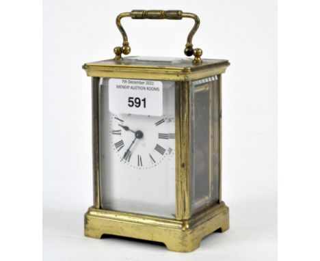 A gilt metal and bevelled glass carriage clock, Roman numerals to the face denoting hours, height 11cm