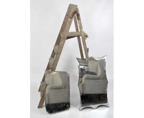 Two bevelled wall mirrors and a wooden step ladder, height 130cm