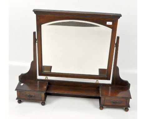 An early 20th century inlaid mahogany dressing table mirror with arched top bevelled mirror over a shallow shelf flanked by t