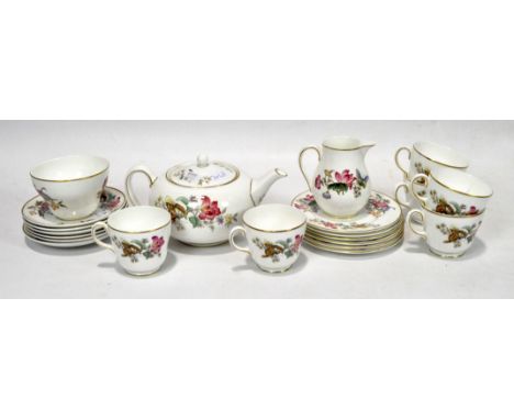 A Wedgwood part tea service in the 'Sandon' pattern, including cups and saucers, plates, a milk jug, sugar bowl and a teapot