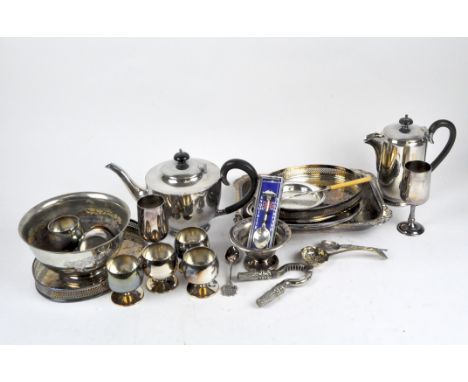 A collection of silver plate, including glasses, a teapot, fruit bowl, trays and flatware.