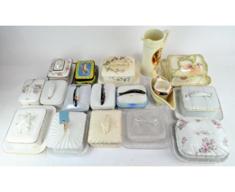 A large selection of ceramic and lidded sardine dishes with various decoration, including French, Czech and English examples