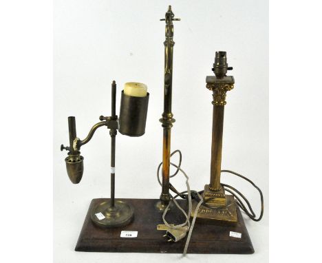 A handmade brass Victorian lamp adapted to also hold a candle, together with an electric lamp base of column form and an inco