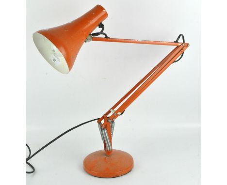 A vintage orange anglepoise style lamp, height circa 90cm