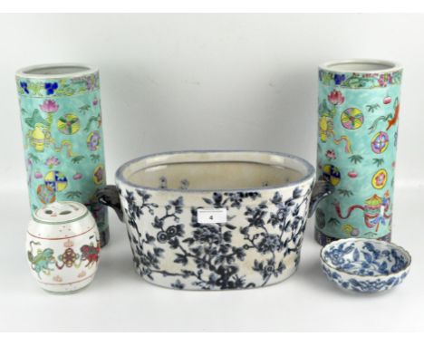 A pair of 20th century cylindrical Chinese vases decorated with the Eight Buddhist Symbols on a turquoise ground, height 28cm