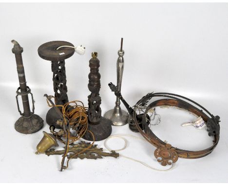 A group of vintage lighting, including Palmer &amp; Co patent candlestick, carved wooden table lamp and more.