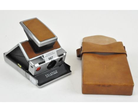 A Polaroid SX-70 land camera in original leather case