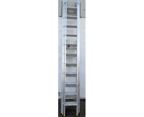 A large extendable three section ladder, 710cm high, when fully extended,&nbsp;together with a folding step ladder