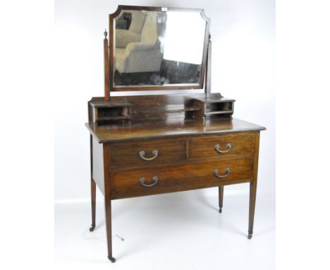 A Victorian mahogany dressing table with mirror, two short drawers above a single long drawer with metal handles, on tapered 