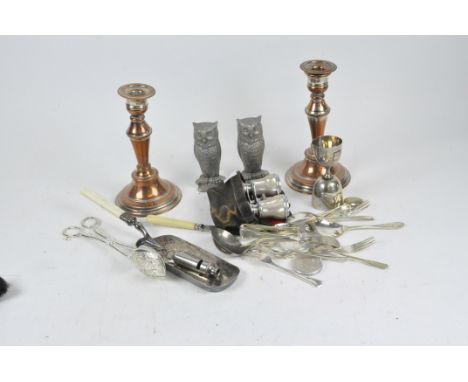 A pair of copper and silver plated candlesticks, together with two owl paperweights, a pair of mother of pearl opera glasses 